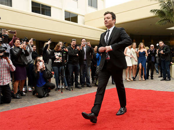 <u>Query</u>: Comedian and host of the Tonight Show arriving at an award ceremony<br>
      <u>Named Entity</u>: Jimmy Fallon