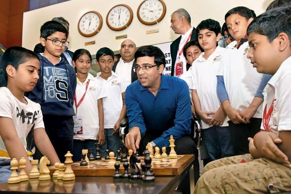 <u>Query</u>: Kids learning to play chess from a former Indian world champion<br>
      <u>Named Entity</u>: Vishwanathan Anand